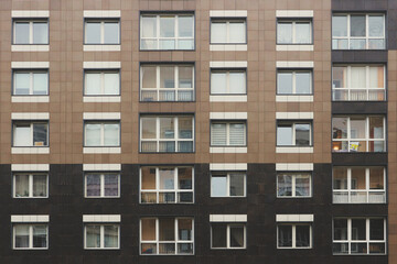 Fototapeta na wymiar Windows residential high-rise buildings. Abstract urban background.