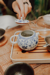 Woman serving Chinese tea in a tea ceremony.