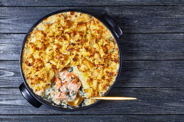 salmon pot pie in a baking dish