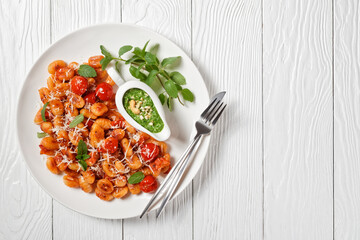 Italian gnocchi with pesto, top view, copy space