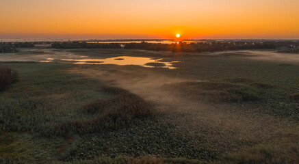 Foggy sunrise in the Volga river delta.