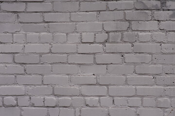Obraz premium Old brick wall, painted gray. close-up. The view from the street.