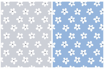Fototapeta na wymiar Cute Hand Drawn Irregular Floral Vector Patterns with White Tiny Flowers Isolated on a Blue and Light Gray Background. Funny Infantile Style Garden Print ideal for Fabric, Textile.