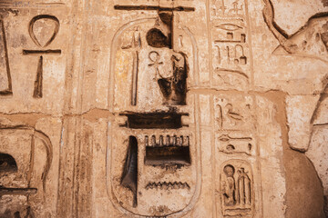 Deep set ancient Egyptian hieroglyphics and cartouche in Hatsepsut temple in Luxor