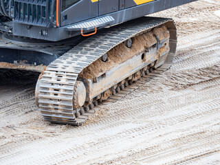 Continuous tracks on a heavy excavator digger machine with track detail