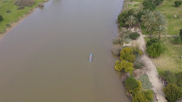 Two seat Sport Canoe rowing on tranquil water, Aerial view.