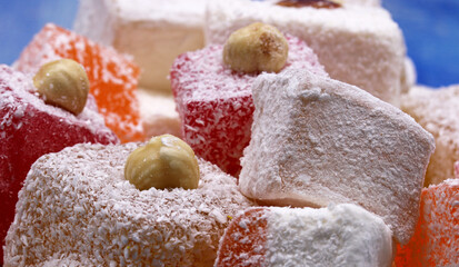 Turkish delight on blue wooden background