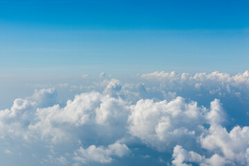 View of blue sky and white clouds during the flight