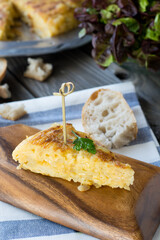Spanish omelette tapa on a wooden table 