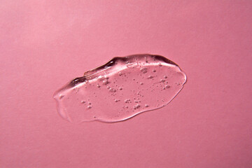 Cosmetic gel product on pink background. Texture and background