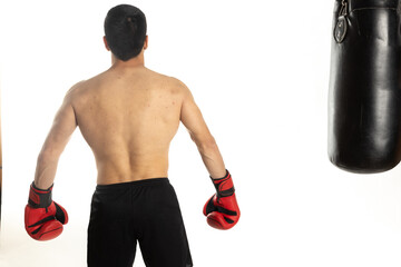 Athlete man training with boxing gloves on white background.