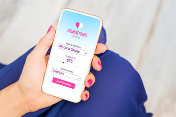 Woman donating money by using phone
