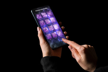 Astrology app on phone with daily horoscopes for all zodiac signs