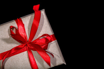 Christmas gift box with red ribbon. Black friday sale concept.
