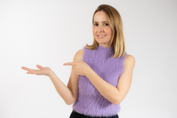 Young woman over isolated white background pointing fingers to the side