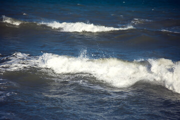 Sea waves and foam of Mediterranean sea with strong wind, Spain,