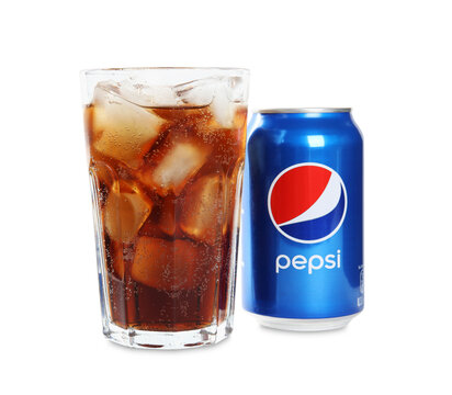 MYKOLAIV, UKRAINE - FEBRUARY 10, 2021: Glass and can of Pepsi on white background