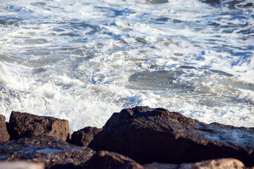 Sea waves and foam of Mediterranean sea with strong wind, Spain,