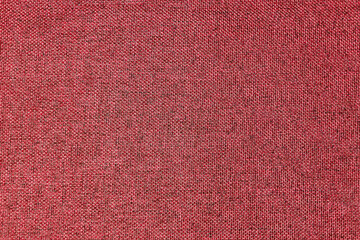 Dark red, burgundy, grainy textured surface, top view, banner. Background of magenta cloth thread texture. Small geometric seamless fabric texture. Copy space