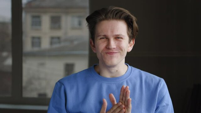 Close-up of insidious cunning male face. Portrait of sly crafty caucasian millennial man coming up with plan idea rubbing his hands palms getting ready to do tricky evil, people and emotions concept