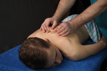 The back massage is manual. The specialist massages the back