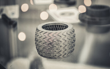 Selective Laser Melting. Object printed on metal 3d printer close-up.