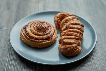 puff pastry. maple pecan with maple syrup and a round cinnamon bun