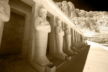 Black and white view on ancient statues in historical city of the dead