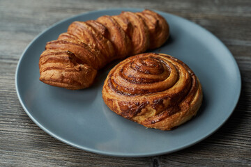 two delicious puff pastry buns on a plate