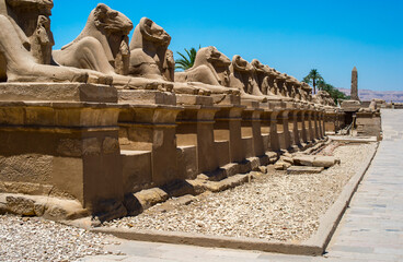 line of ancient creature statues in historical temple 