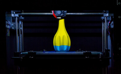 Automatic 3D printer performs plastic modeling in laboratory.