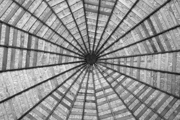 Wooden roof from bottom in black and white.