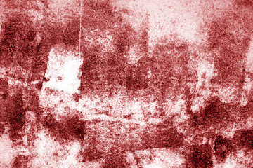 Grungy rusted metal surface in red tone.