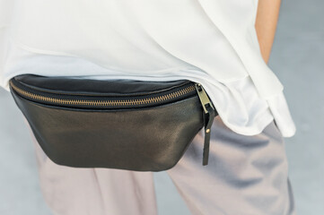 Black Leather Waist Bag For Women Small Leather Bum Bag. Fashionable bag on the girl's belt.