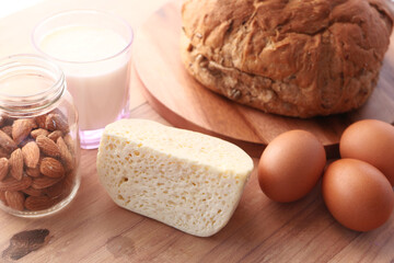 Fresh dairy products, milk, cottage cheese, eggs, yogurt on table