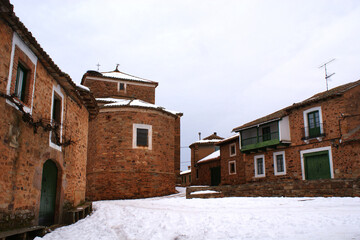 Fototapeta na wymiar square, stone church and houses in a village in spain