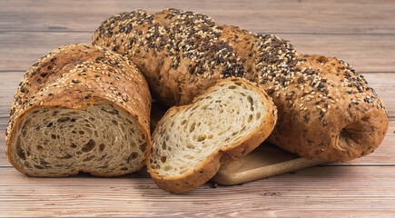 close up of whole wheat bread on wooden table