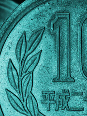Translation: 2015. Japanese 10 yen coin. Fragment close-up. Dramatic aquamarine vertical illustration. Money, economy, finance of Japan. A picture on the topic of taxes and financial management. Macro