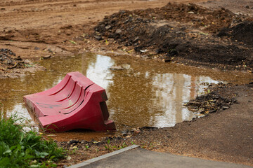 excavated road. repair of the street in the city with road equipment. laying of new asphalt and replacement of communications