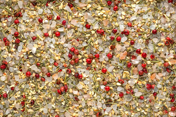 Close up background texture  of himalayan salt crystals with garlic, rosemary and pepper