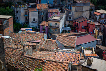 Congested living with colorful red tile rooftops in Castiglione di Sicilia in Sicily.