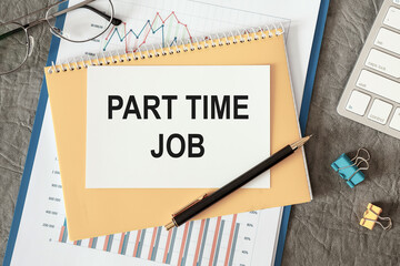 Part time job is written in a document on the office desk