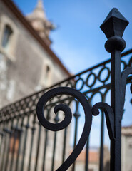 Decorative black rod iron fence post in streets of Sicily