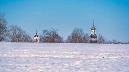 Dutch winter landscape near the village of Ootmarsum. The towers of the Reformed Church and the Catholic Simon and Judas Church can be seen. It lies in the eastern part of The Netherlands. 