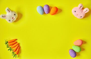 Easter white and pink bunny on yellow background. Happy Easter. Holiday concept.