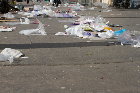 plastics and paper polluting streets and flying through the pavements