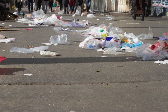 street pollution - trash and plastics flying on the city pavement