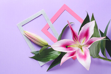 Creative composition with lilies on color background