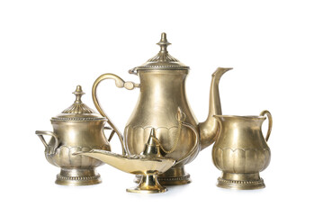 Aladdin lamp of wishes and tea set on white background