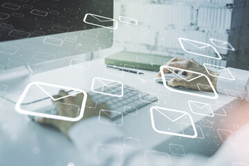 Creative concept of postal envelopes illustration with hands typing on laptop on background. Email and communications concept. Multiexposure